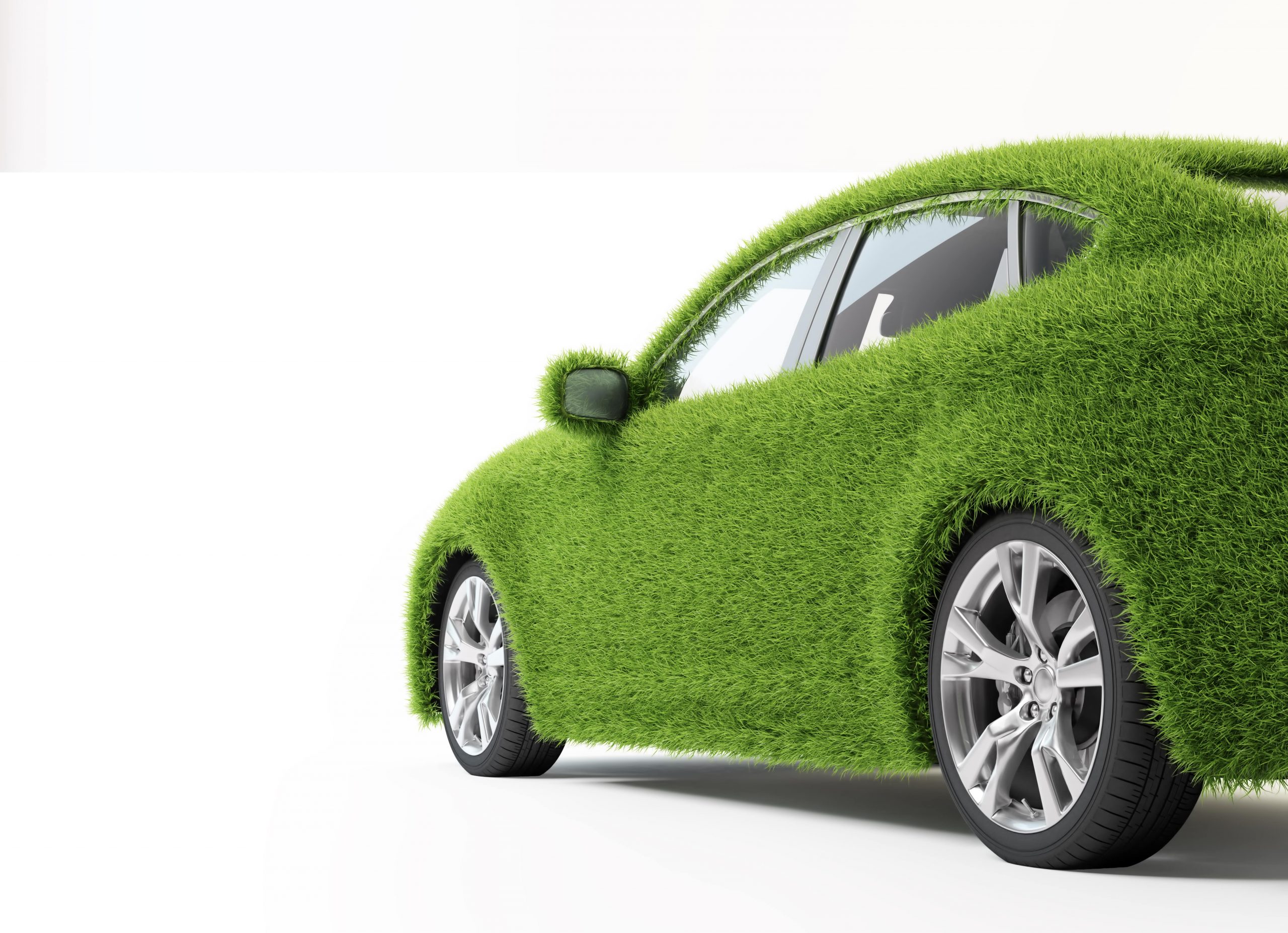 Green, eco-friendly transport concept - grass covered car.